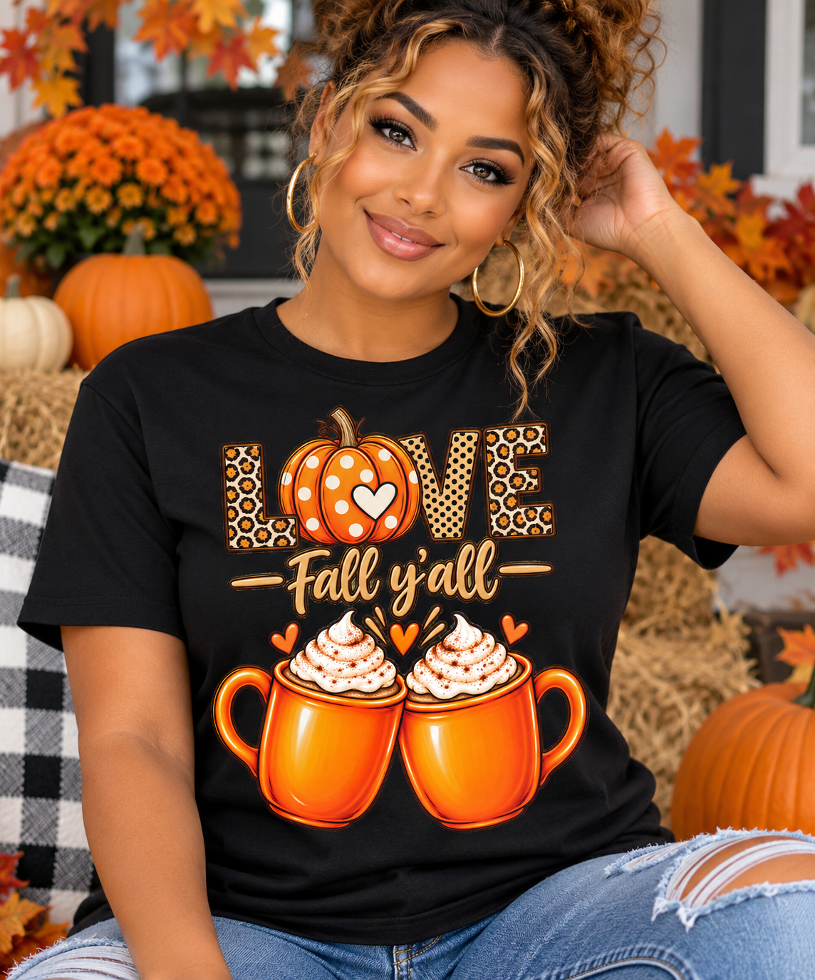 Woman wearing a black Love Fall Y’all unisex T-shirt featuring leopard print, pumpkin and two orange coffee mugs fall graphic design