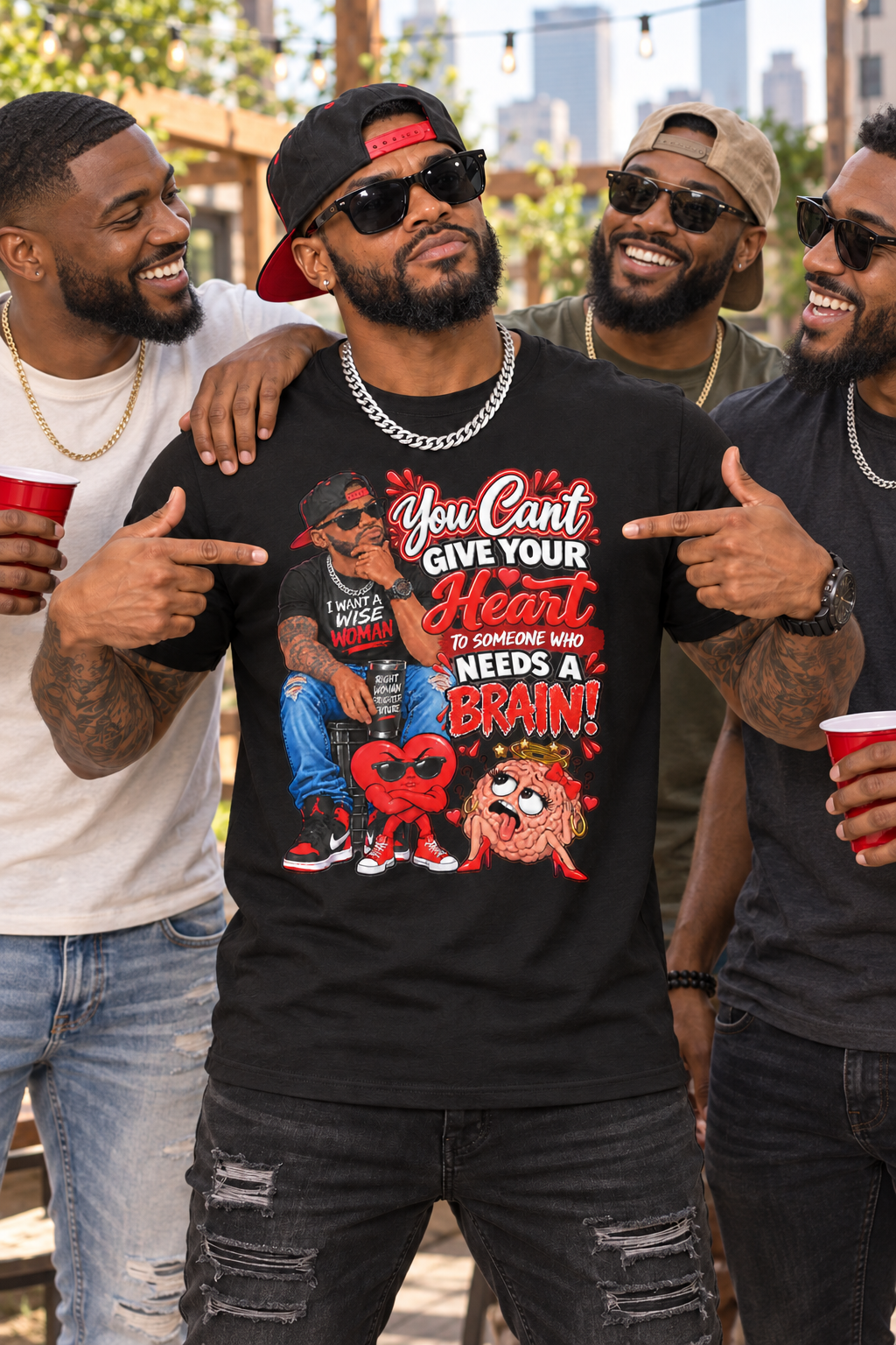 Stylish Black man with friends pointing to a black unisex T-shirt featuring the You Can’t Give Your Heart to Someone Who Needs a Brain design

