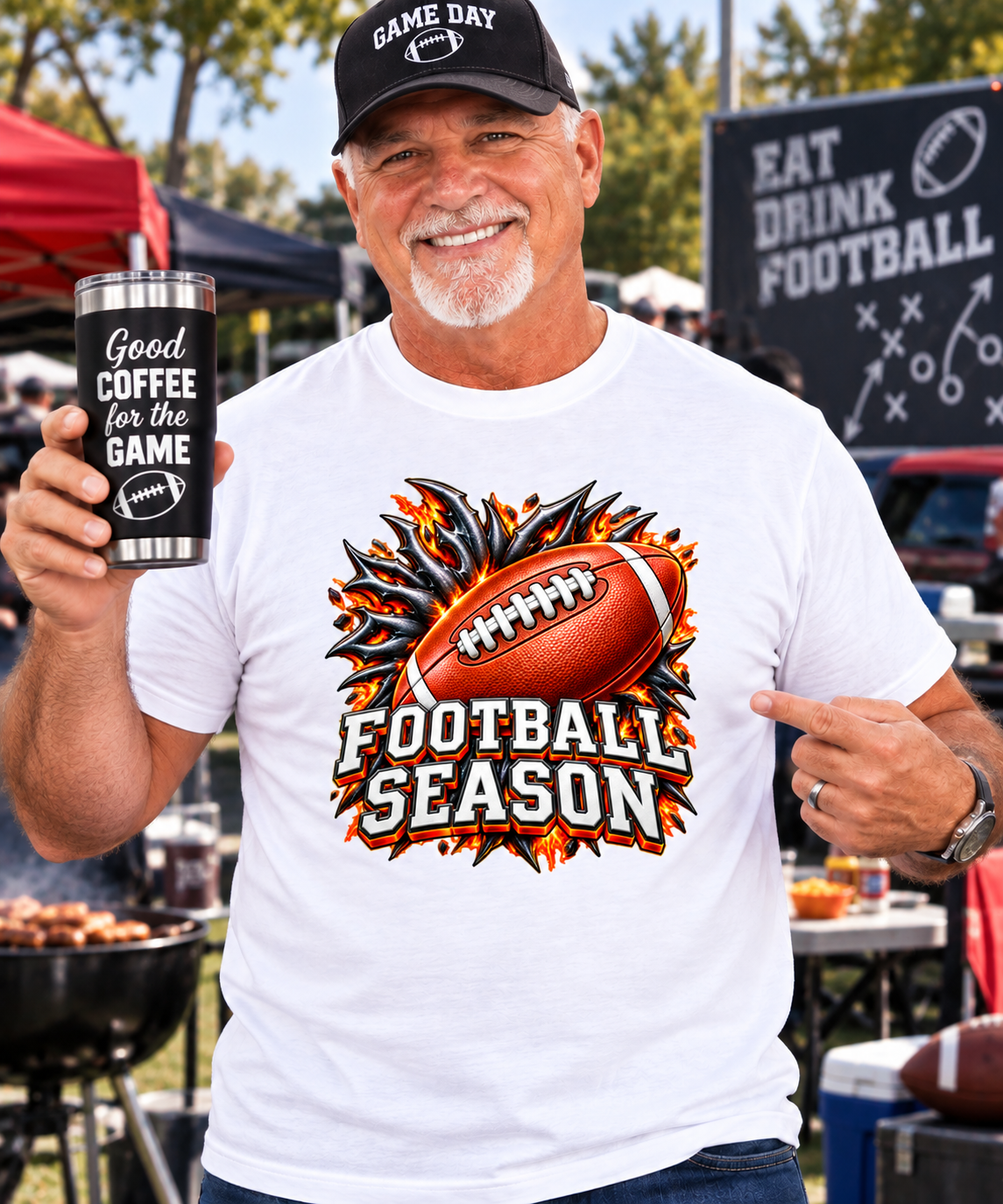 Older male football fan wearing a white Football Season Breakout Design T-shirt and holding a Good Coffee for the Game insulated tumbler at a football tailgate